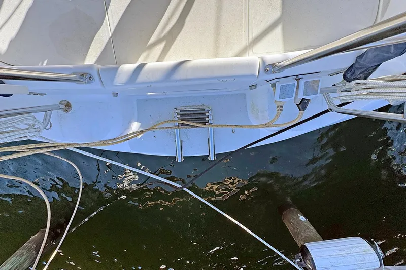 Slide: The Image of Catalina 36 MkII 2000 yacht stern view with ladder and ropes over water. - 46