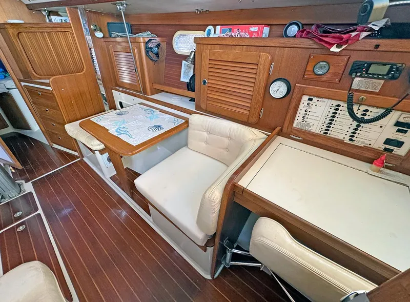 Slide: The Image of Interior of 2000 Catalina 36 MkII sailboat with wood paneling and navigation station. - 5