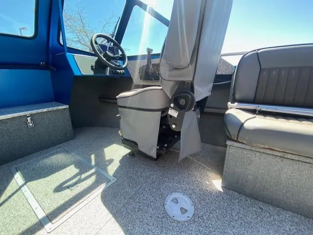 Slide: The Image of 2017 Alumaweld Intruder boat interior with steering wheel and seating. - 14