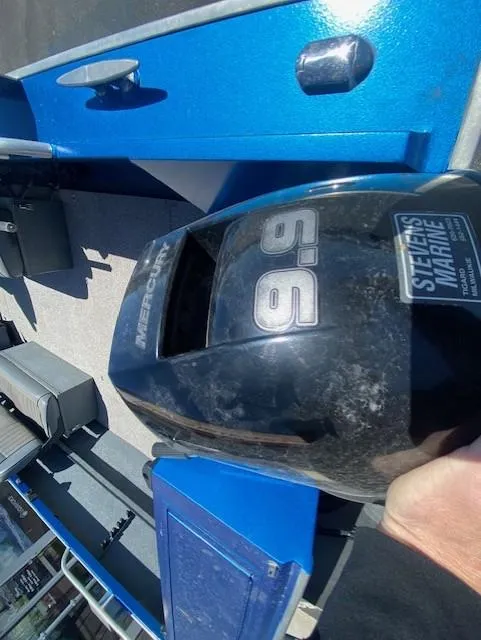 Slide: The Image of 2017 Alumaweld Intruder boat with Mercury 9.9 engine, blue interior. - 18