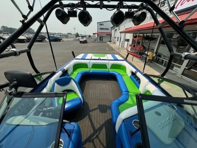 Slide: The Image of 2005 Calabria Cal Air Pro-V boat with colorful seating and tower lights at a marina. - 14