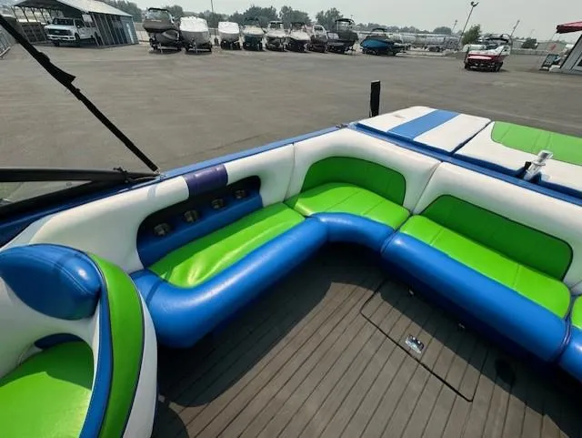 Slide: The Image of 2005 Calabria Cal Air Pro-V boat interior with vibrant green and blue seating. - 15