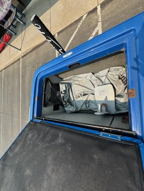 Slide: The Image of Open storage compartment of a 2005 Calabria Cal Air Pro-V boat. - 21