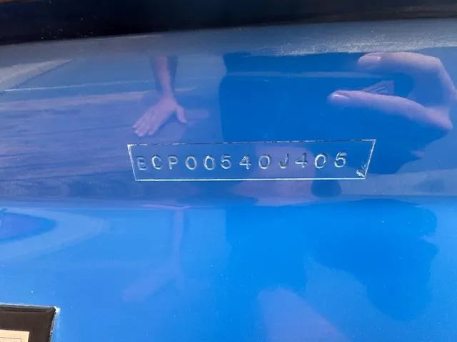 Slide: The Image of 2005 Calabria Cal Air Pro-V boat hull identification number on blue surface. - 23