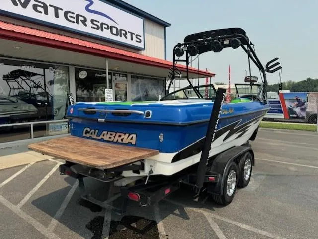 Slide: The Image of 2005 Calabria Cal Air Pro-V boat on trailer outside Water Sports store. - 3