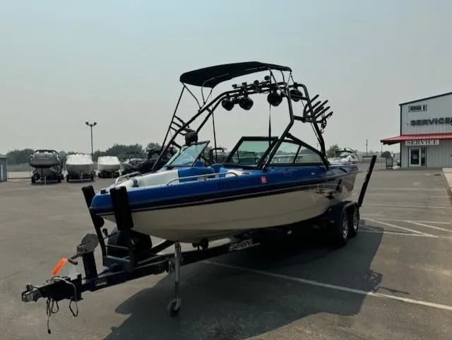 Slide: The Image of 2005 Calabria Cal Air Pro-V boat on trailer in parking lot. - 7