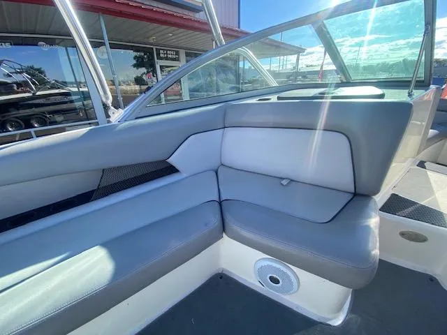 Slide: The Image of 2006 Centurion Air Warrior Elite C-4 boat interior with gray seating and speaker. - 14