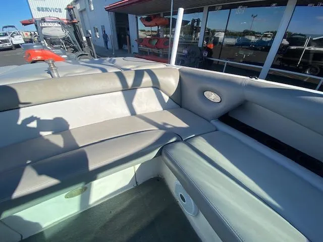 Slide: The Image of 2006 Centurion Air Warrior Elite C-4 boat interior with gray seating and outdoor view. - 15