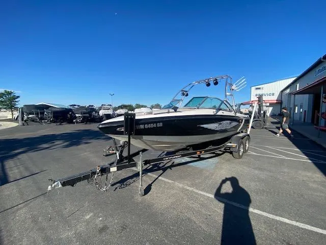 Slide: The Image of 2006 Centurion Air Warrior Elite C-4 boat on trailer in parking lot. - 5