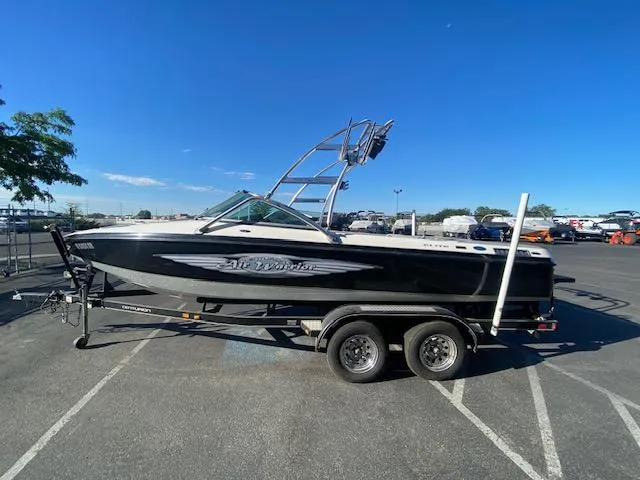 Slide: The Image of 2006 Centurion Air Warrior Elite C-4 boat on trailer in parking lot. - 6