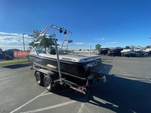 Slide: The Image of 2006 Centurion Air Warrior Elite C-4 boat on trailer in parking lot. - 7