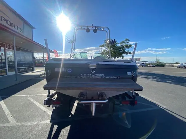 Slide: The Image of 2006 Centurion Air Warrior Elite C-4 boat parked in a sunny lot. - 8