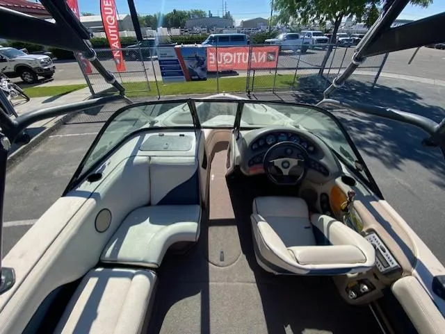 Slide: The Image of 2001 Nautique Super Air Nautique 210 boat interior with seating and dashboard. - 10