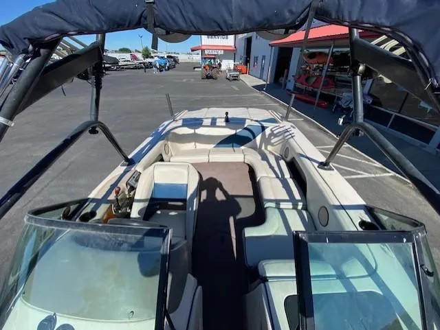 Slide: The Image of 2001 Nautique Super Air Nautique 210 boat interior at a marina. - 13
