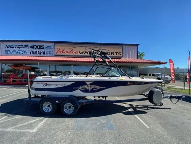 Slide: The Image of 2001 Nautique Super Air Nautique 210 boat on trailer at Idaho Water Sports dealership. - 2
