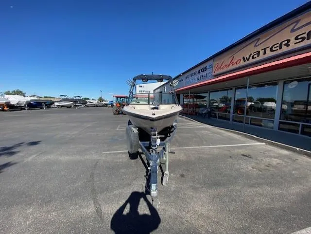 Slide: The Image of 2001 Nautique Super Air Nautique 210 boat on trailer at dealership parking lot. - 8