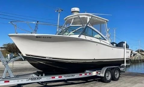 Slide: The Image of 2013 Carolina Classic 25 Express boat on trailer, ready for transport. - 0