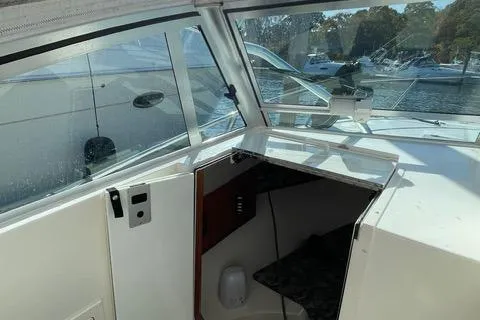 Slide: The Image of 2013 Carolina Classic 25 Express boat interior with open cabin view. - 8