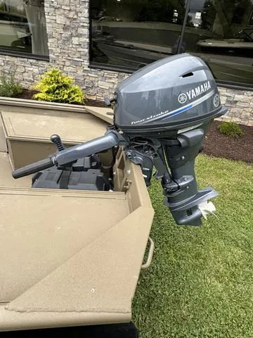 Slide: The Image of 2024 G3 16 FL boat on trailer, parked on grass near a building. - 10