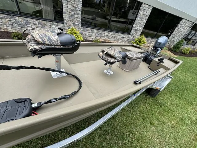 Slide: The Image of Open storage compartment in 2024 G3 16 FL boat, showing interior details. - 5