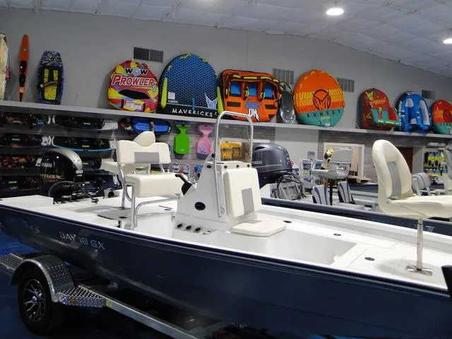 Slide: The Image of 2024 G3 Bay 18 GX boat, top view, featuring seating and motor. - 3