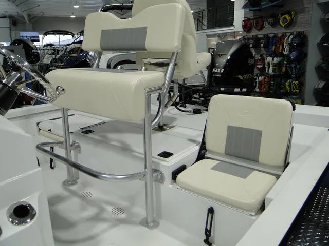 Slide: The Image of 2024 G3 Bay 18 GX boat deck with seating and storage compartments. - 5