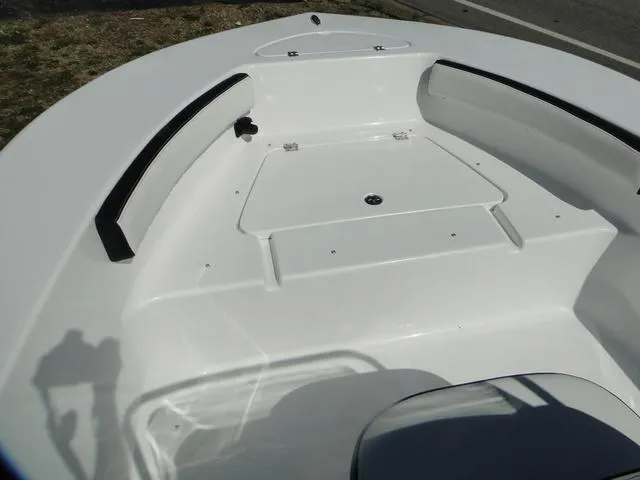 Slide: The Image of 2024 Tidewater 180 CC Adventure boat interior with spacious seating and storage. - 6