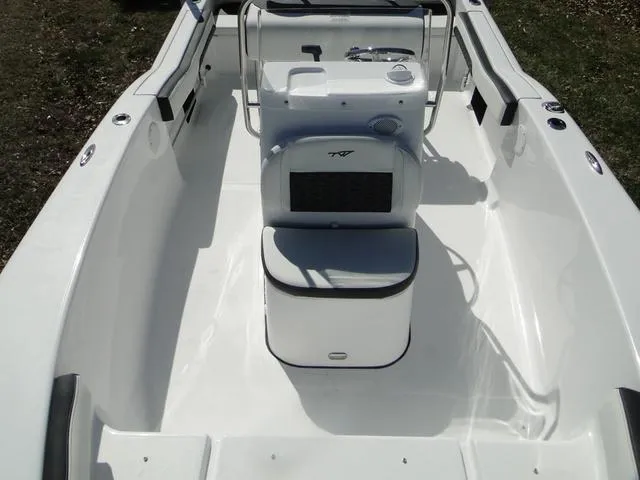 Slide: The Image of 2024 Tidewater 180 CC Adventure boat interior with console and seating. - 7