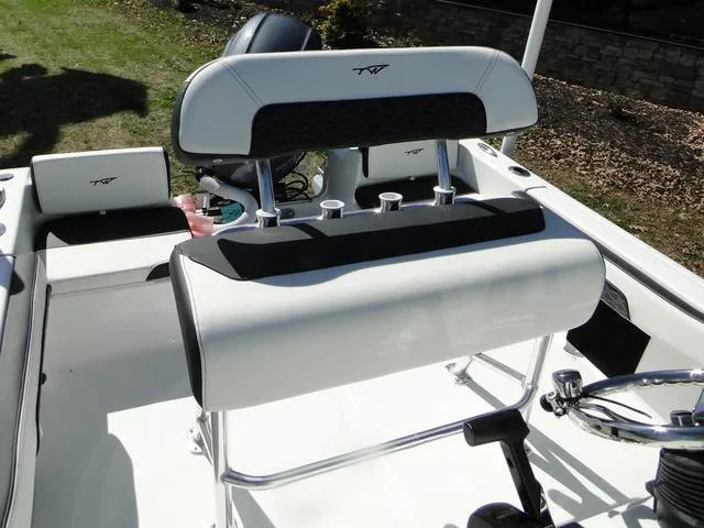 Slide: The Image of 2024 Tidewater 180 CC Adventure boat interior with sleek seating and console design. - 8
