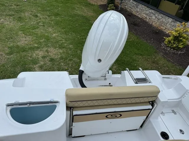 Slide: The Image of 2024 Sportsman Open 212 boat with outboard motor and seating, viewed from above. - 12