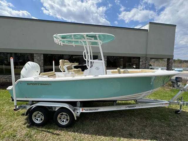 Slide: The Image of 2024 Sportsman Open 212 boat on trailer, parked outdoors. - 2
