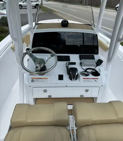 Slide: The Image of 2024 Sportsman Open 212 boat dashboard with steering wheel and controls. - 4
