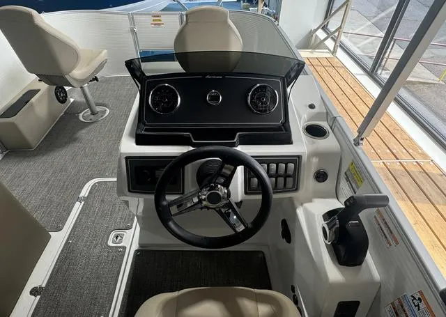 Slide: The Image of 2024 Hurricane FunDeck 1960 REF boat dashboard with steering wheel and controls. - 11