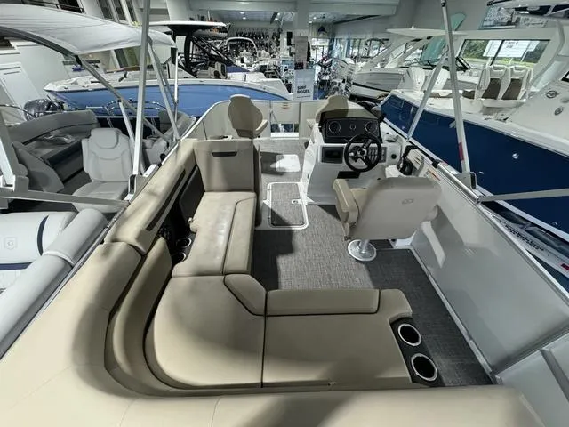 Slide: The Image of 2024 Hurricane FunDeck 1960 REF boat interior with seating and steering console. - 4