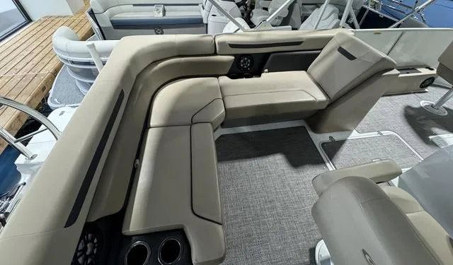 Slide: The Image of 2024 Hurricane FunDeck 1960 REF boat interior with beige seating and modern design. - 5