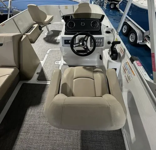 Slide: The Image of 2024 Hurricane FunDeck 1960 REF boat interior with steering console and seating. - 6