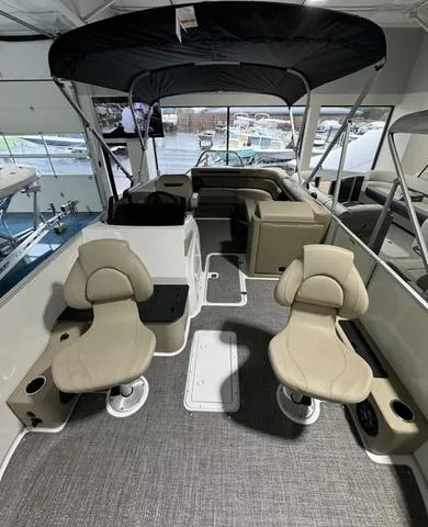 Slide: The Image of 2024 Hurricane FunDeck 1960 REF boat interior with seating and canopy. - 9