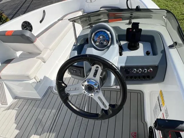 Slide: The Image of 2020 Tahoe T16 boat cockpit with steering wheel and control panel. - 7