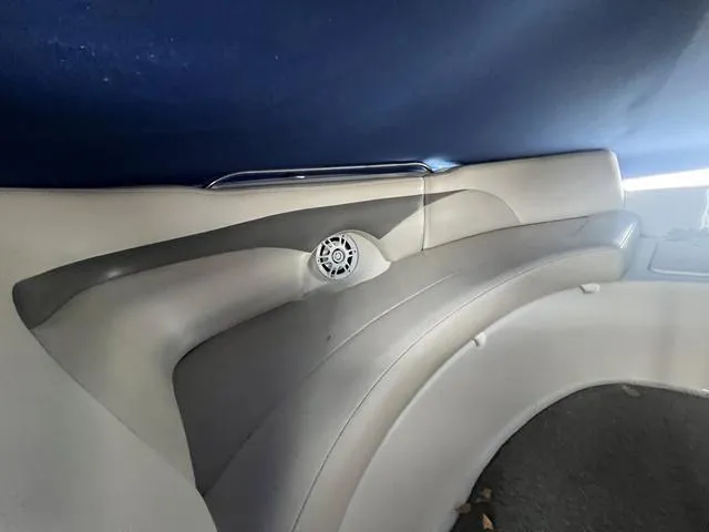 Slide: The Image of Interior of 2005 Chaparral Sunesta 236 boat with speaker and cushioned seating. - 15