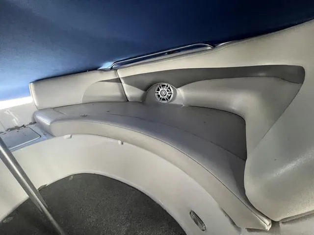 Slide: The Image of 2005 Chaparral Sunesta 236 boat interior with curved seating and speaker. - 16