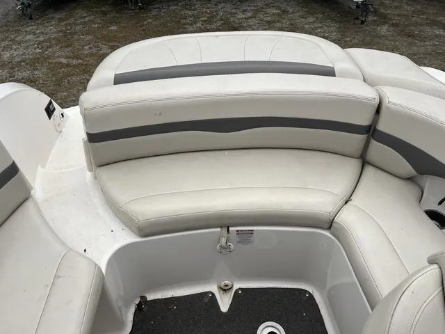 Slide: The Image of 2005 Chaparral Sunesta 236 boat interior with white and gray seating. - 6
