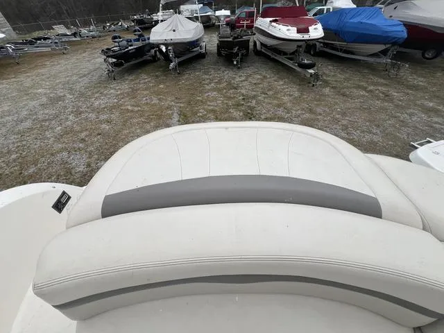 Slide: The Image of 2005 Chaparral Sunesta 236 boat interior with other boats in the background. - 7