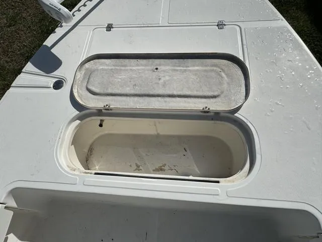 Slide: The Image of Open storage compartment on a 2003 Sea Fox 180FF boat deck. - 12