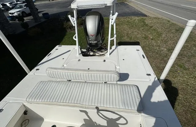 Slide: The Image of 2003 Sea Fox 180FF boat with Yamaha 150 engine, white seating, and spacious deck. - 8