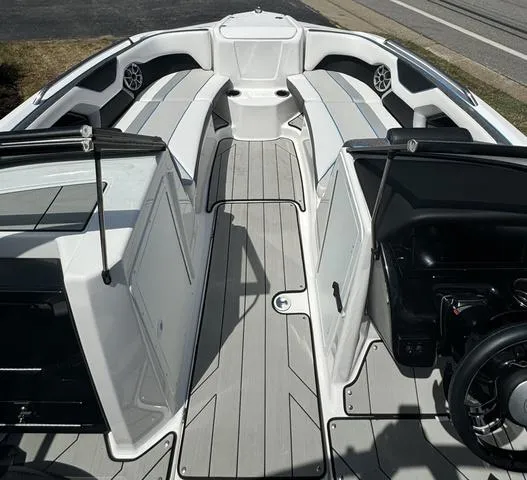 Slide: The Image of 2022 Yamaha Boats 212XD interior with sleek seating and modern dashboard design. - 4
