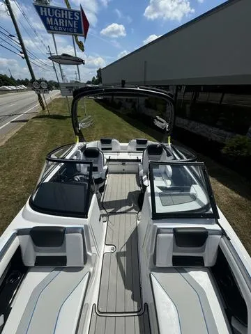 Slide: The Image of 2022 Yamaha Boats 212XD, sleek design, parked at Hughes Marine Service. - 9
