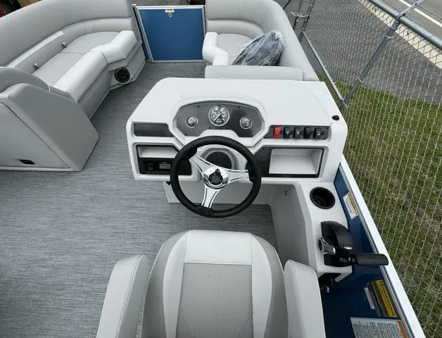 Slide: The Image of 2024 Godfrey Xperience 2286 SBX boat interior with steering console and seating. - 5