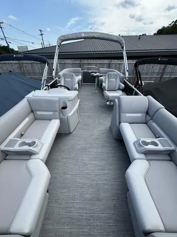 Slide: The Image of 2024 Godfrey Xperience 2286 SBX pontoon boat with spacious seating and modern design. - 3