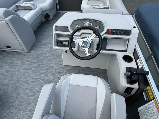 Slide: The Image of 2024 Godfrey Xperience 2286 SBX boat interior with steering wheel and seating. - 4
