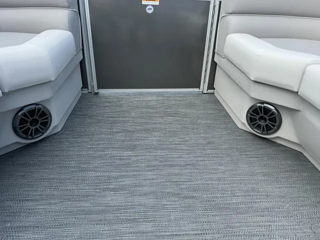 Slide: The Image of 2024 Godfrey Xperience 2286 SBX interior with gray carpet and built-in speakers. - 9
